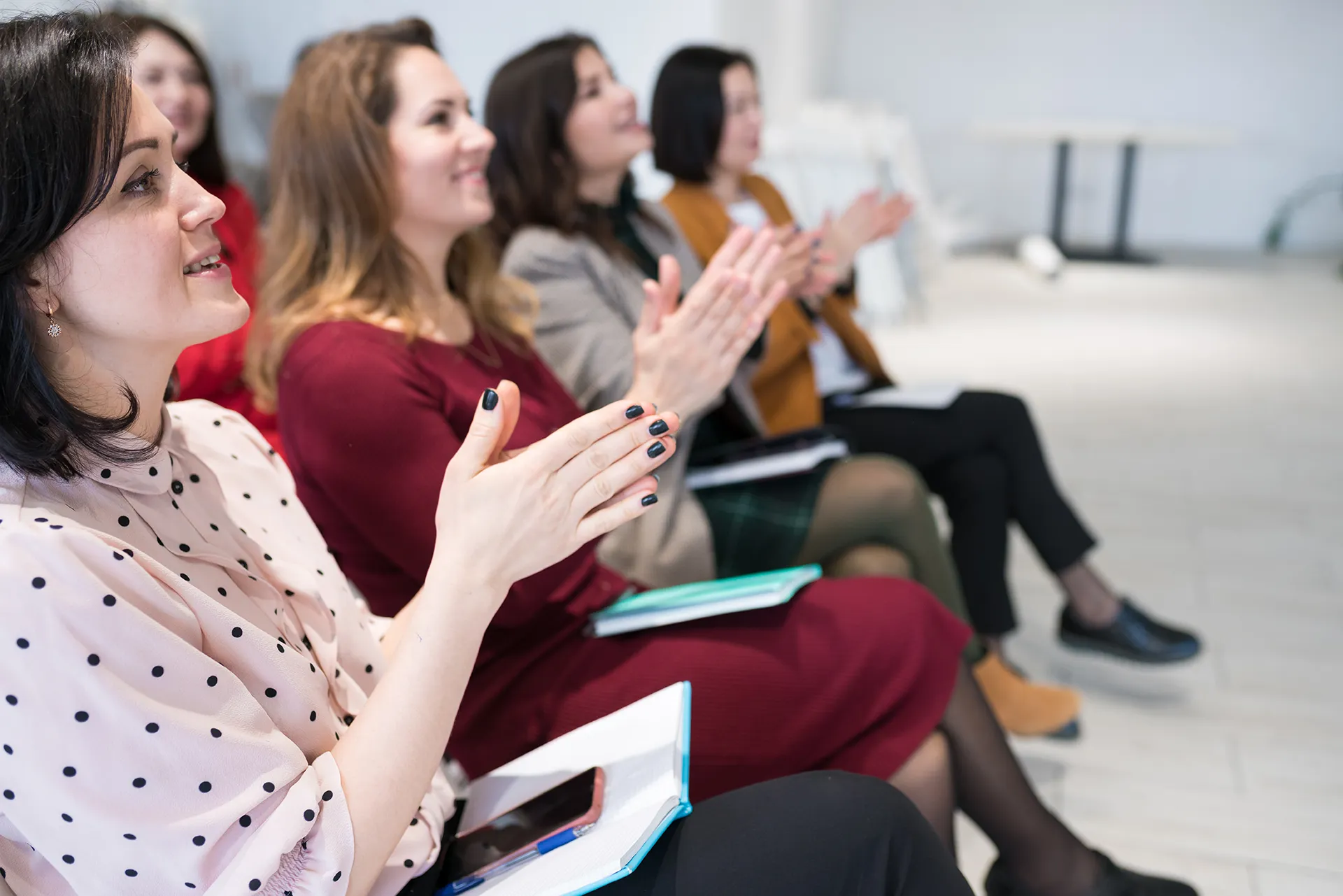 women applauding speaker at group session sittin 2023 11 27 05 11 46 utc